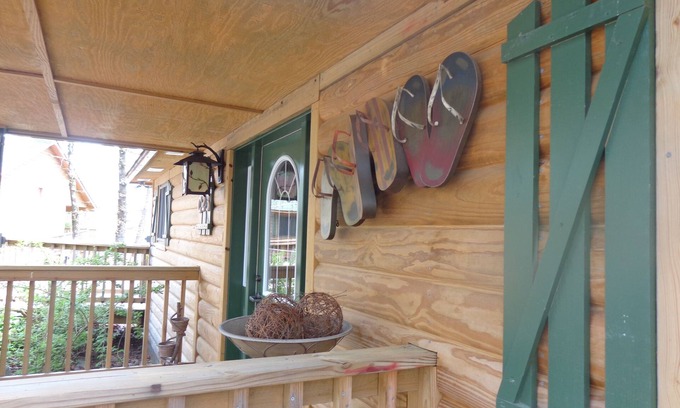 Mount Ida Cottage | Lake view two bedroom, two bath log-sided cottage with private hot tub overlooking Lake Ouachita. by RedAwning