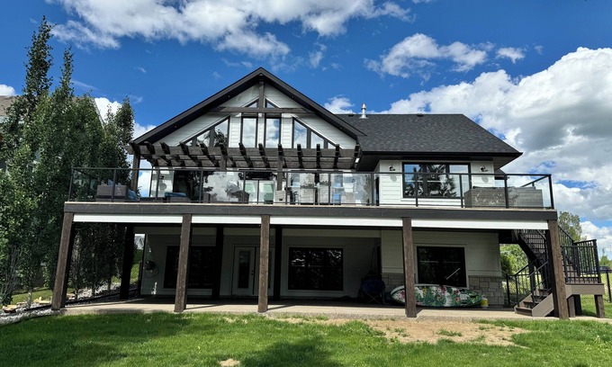 Parkland Beach House | Large lakefront retreat with private dock.
