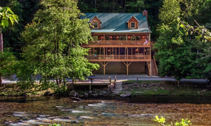 Sylva Cabin | Log cabin with large decks on the Bank of the Tuckasegee River.