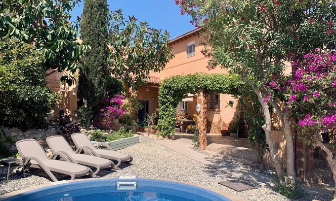 Los Vives House | Loma Alta; a unique 19th century cave house with lush garden and private pool