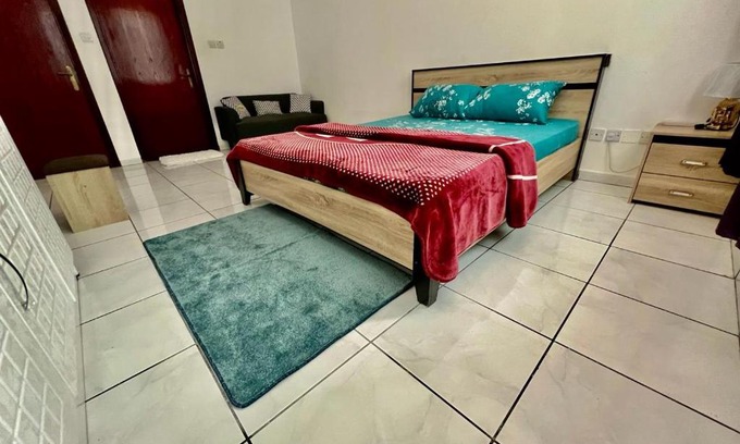 Al Majaz House | Luxury Awaits: Master Bedroom for Rent! Indulge in comfort and style.