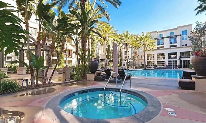 Airport Area Condo | Luxury Coastal Retreat Walkable area, Pool, Mins to Newport Beach,Airport & more