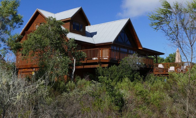Wilderness House | Luxury log home with lake and mountain views, close to world-class golf courses