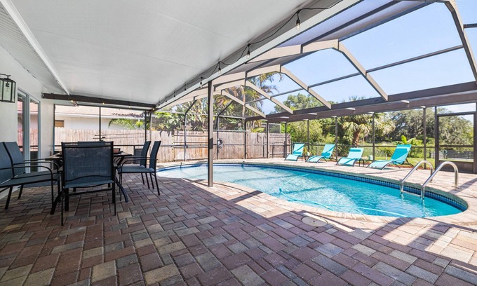 Orchid Lake Village House | Luxury Pool Home! Heated Pool, Fire Pit, Fishing Dock & More – Relaxation & Fun Await!