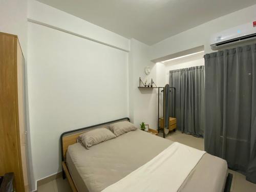 Tangerang Apartment | Minimalist room at The Nest Apartment by Popobella Near Puri Indah West Jakarta