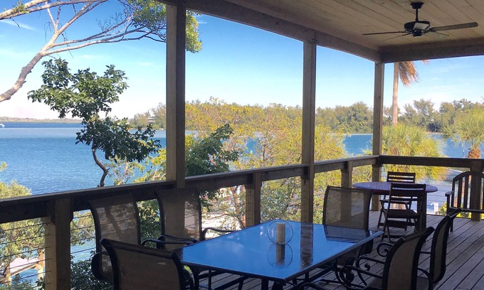 Longbeach Village House | Modern Bayfront Retreat with boat dock and short walk to Beach