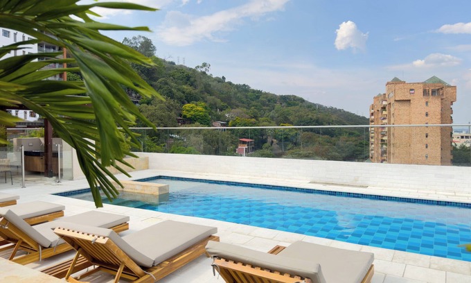 Cali Apartment | Modern, Bright, Quiet Apartment in Granada: A/C, Pool, Desk & Balcony