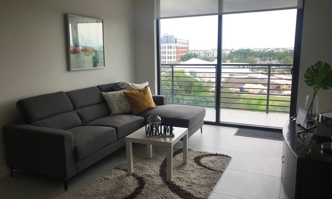 Doral Condo | Modern building, centrally-located condo,2 bedrooms/2 bathrooms, parking space.
