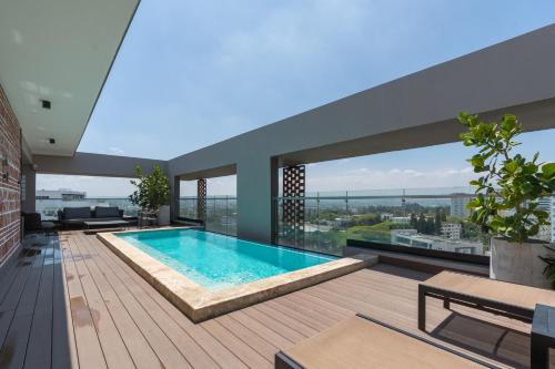 Santiago Province Apartment | Modern Luxury Condo with Rooftop Pool & Gym