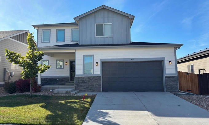 Milliken House | Modern home with a large fenced yard, and garage access