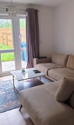 Little Hulton Apartment | Modern Home with Private Garden and Car Park in Manchester