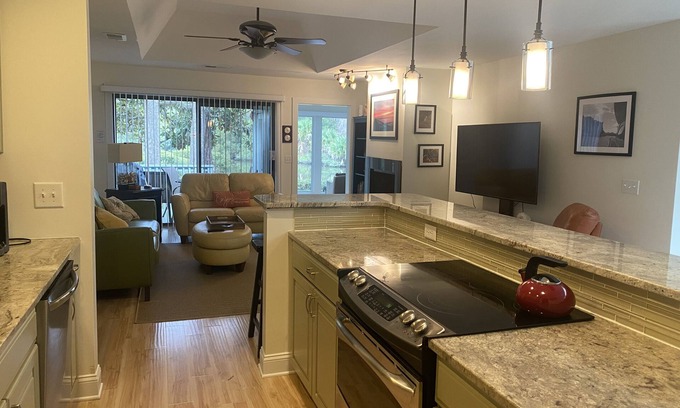 West Beach Cottage | Modern Lagoon View Steps from Beach Pool & Golf