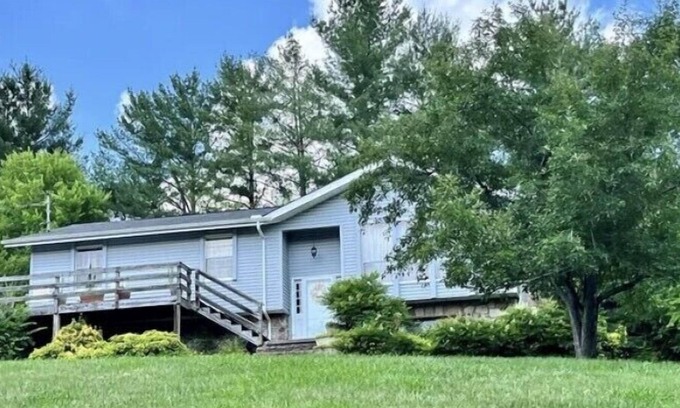 Kodak House | Nestled in the woods above the French Broad River, quite subdivision.
