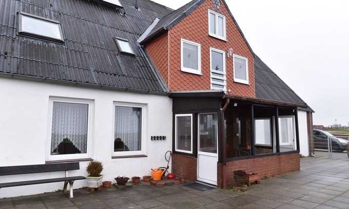 Neufeld House | Nordseehaus Op'n'Diek on the dike overlooking the small Priel harbor.