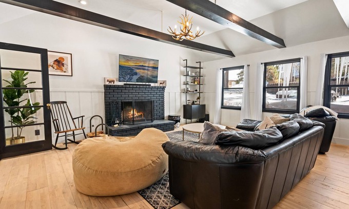 Boulder Bay House | Nostalgic vibe with modern amenities in midcentury log cabin with hot tub + more