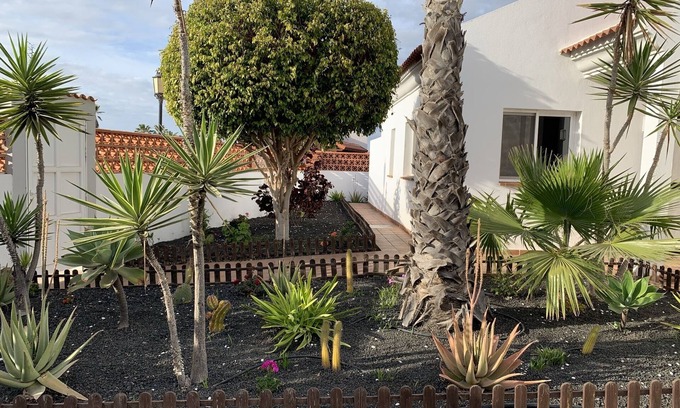 Corralejo Villa | Ocean Vibes is spacious private villa with a large pool and beautiful gardens.