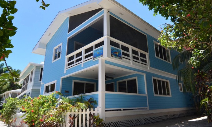 West Bay House | Oceanfront beach house with dual-masters & screened balcony on West Bay Beach