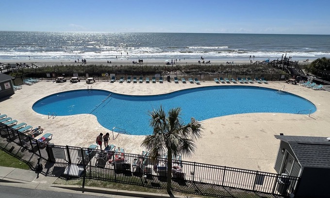 Myrtle Beach Resort | Oceanfront condo incredible views enjoy breakfast on balcony! Window in bedroomn