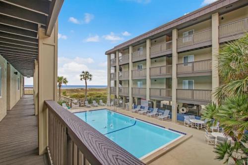 Fernandina Beach House | Oceanview Sand Dollar Villas Condo - Balcony - Pool