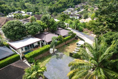 Rawai Villa | Oxavia Garden Oasis in Nai Harn - Your Private Tropical Garden with 3 Cabins and Jacuzzi