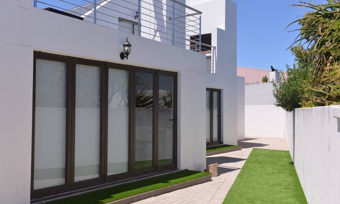 Langebaan House | Pelican Cove is a Modern 4-Bedroom Holiday Home in Langebaan with some Sea Views