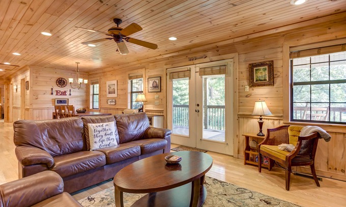 McCaysville Cabin | Pond-front cabin with private hot tub, fireplaces, furnished deck, & game room