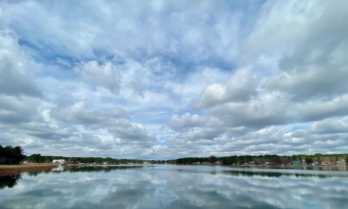 Olivia House | Put your feet up, relax and unwind on the screened porch or go jump in the lake!
