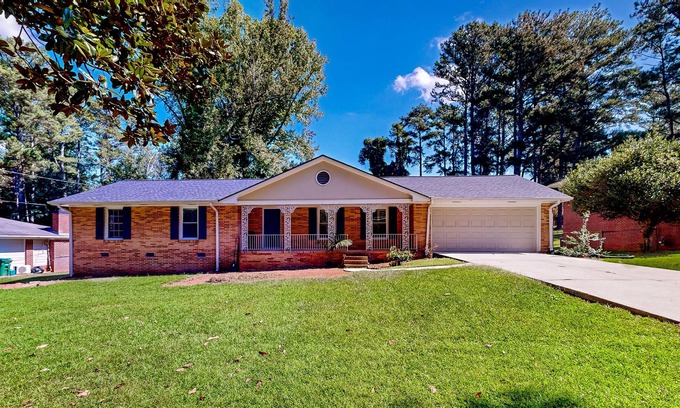 Tucker House | Quiet home in a convenient location with large yard, patio, & fireplace