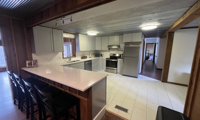 Wilburn House | Rainbow Island Retreat! On the Little Red River. Catch trout from the dock.