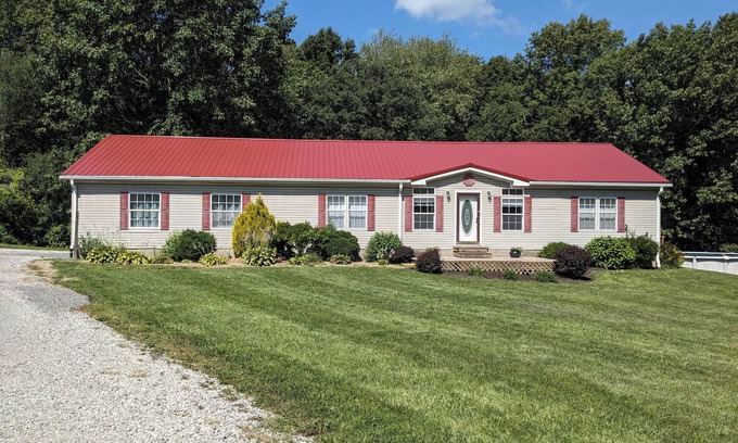 Bluford House | Relax at Woodland Country Lodging, surrounded by the beauty of nature.