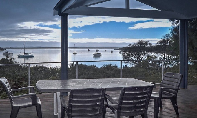 Lake Wangary House | Rest A Shore is a waterfront property with spacious living and north facing panoramic view over the bay from the front deck.