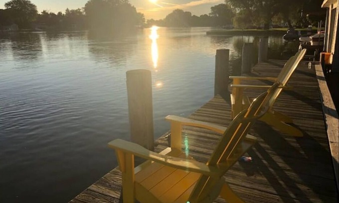 Menasha House | Riverfront Oasis - Hot tub- Seasonal heated pool