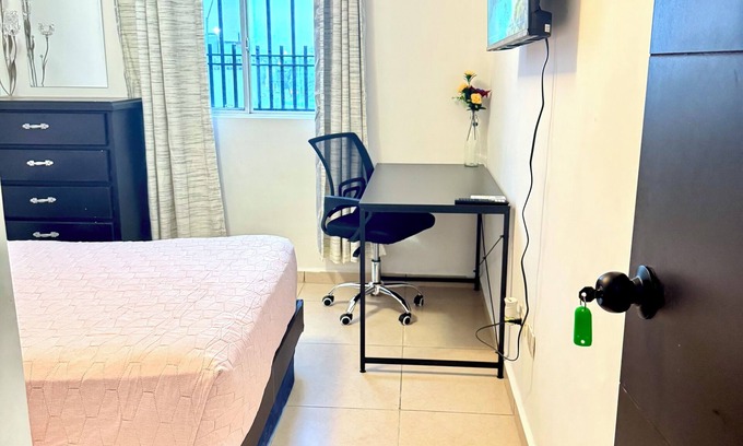 Guadalupe House | Room in Apodaca with work area.