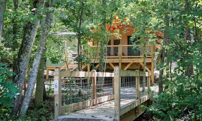 Mill Spring House | Safari Tent nestled in the woods, creek side, furnished balcony, pet friendly, sleeps 5.