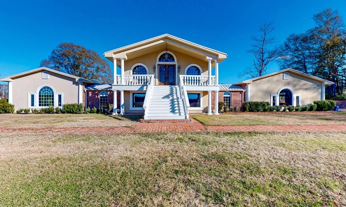 Magnolia Cabin | Secluded acreage with six bedrooms, pool, wood fireplace, ponds, grill, & AC