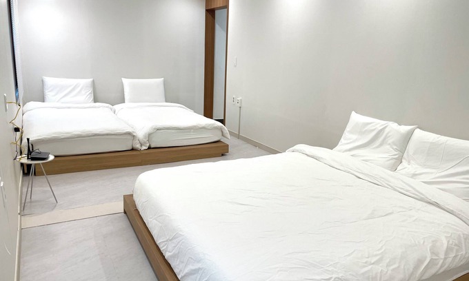 Jung-gu House | Serene building with WiFi in beautiful BusannThere is a large bed.