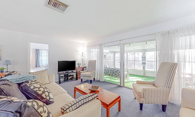 Spring Hill House | Snowbird-friendly waterfront home with water views, screened porch, streaming