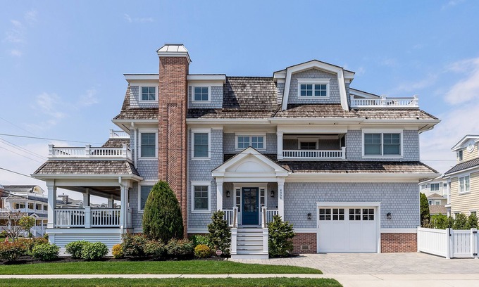 Avalon House | Spacious deck has ocean views as home is across the street from the beachblock.