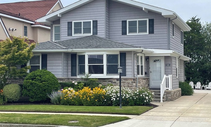 Gardens House | Steps from the pristine Gardens beach. A rare find. Welcome to The Seagate.