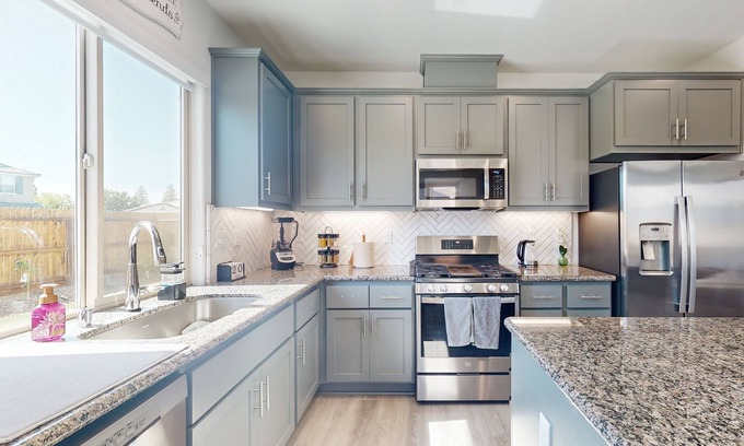 Visalia House | Stunning home with an enclosed yard, pool, jetted tub, board games, W/D, & AC