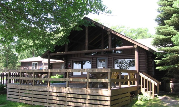 Walker Resort | Stunning Log Home on the water's edge with deck overlooking the swimming pool.