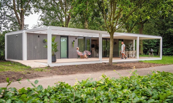 Maasbree House | Stylish and compact hideaway for two with private terrace and large windows, surrounded by forest in North Limburg.