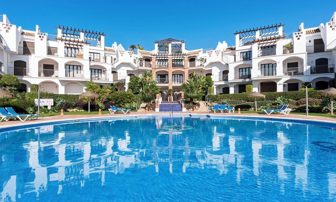 Benahavis Apartment | Sunny balcony with pool by Costarentals - Ref M52