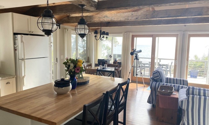 Prospect Harbor House | Take in the breathtaking views at our popular oceanside cottage with large deck.
