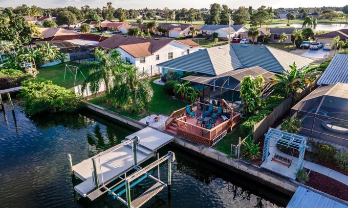 Apollo Beach House | The Flamingo- Waterfront Home with heated pool, hot tub and kayaks!