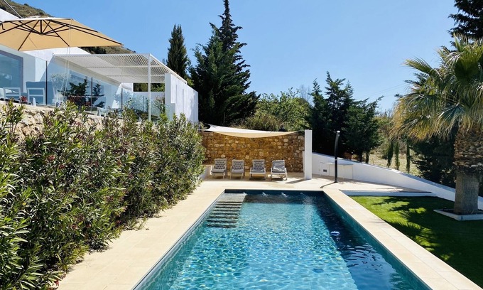 Carataunas House | The Glass House - An elegant, minimalist villa and pool with beautiful views.