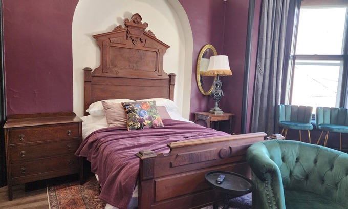 Akron Apartment | The Plum Parlor - Moody Victorian Studio with Timeless Charm