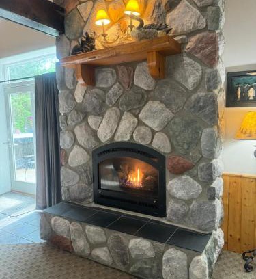 Squaw Lake Resort | The River Condos Hot Tub Fireplace Family & Pet Friendly River Front 2 to 6 bedroom condos dock