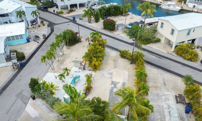 Cudjoe Key RV Rental | Tropical RV Lot Oasis in the Florida Keys with Paved Patio, Full Hookups & Palm-Tree Privacy