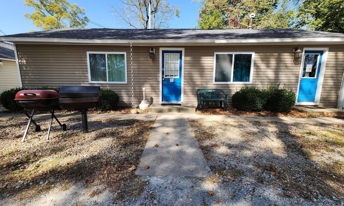 Monticello Cabin | Two Bedroom Cabin - "The Big One" - This spacious cabin gets it's name honestly! Cabin is 800 sq ft with two-bedrooms feature three (3) queen beds, one (1) full size bed, and two (2) futons allow for a max of twelve (12) people. Conveniently located